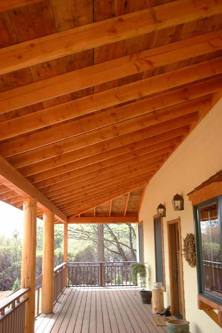 Reclaimed Timbers and Beams, Round Wood Posts Used in the Construction of this Outside Porch